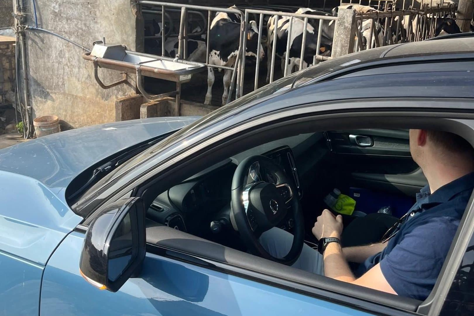 Sales representative at a dairy farm, working from the car